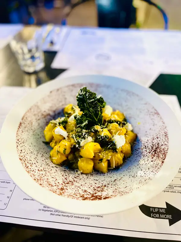 Pumpkin gnocchi with pancetta and asparagus